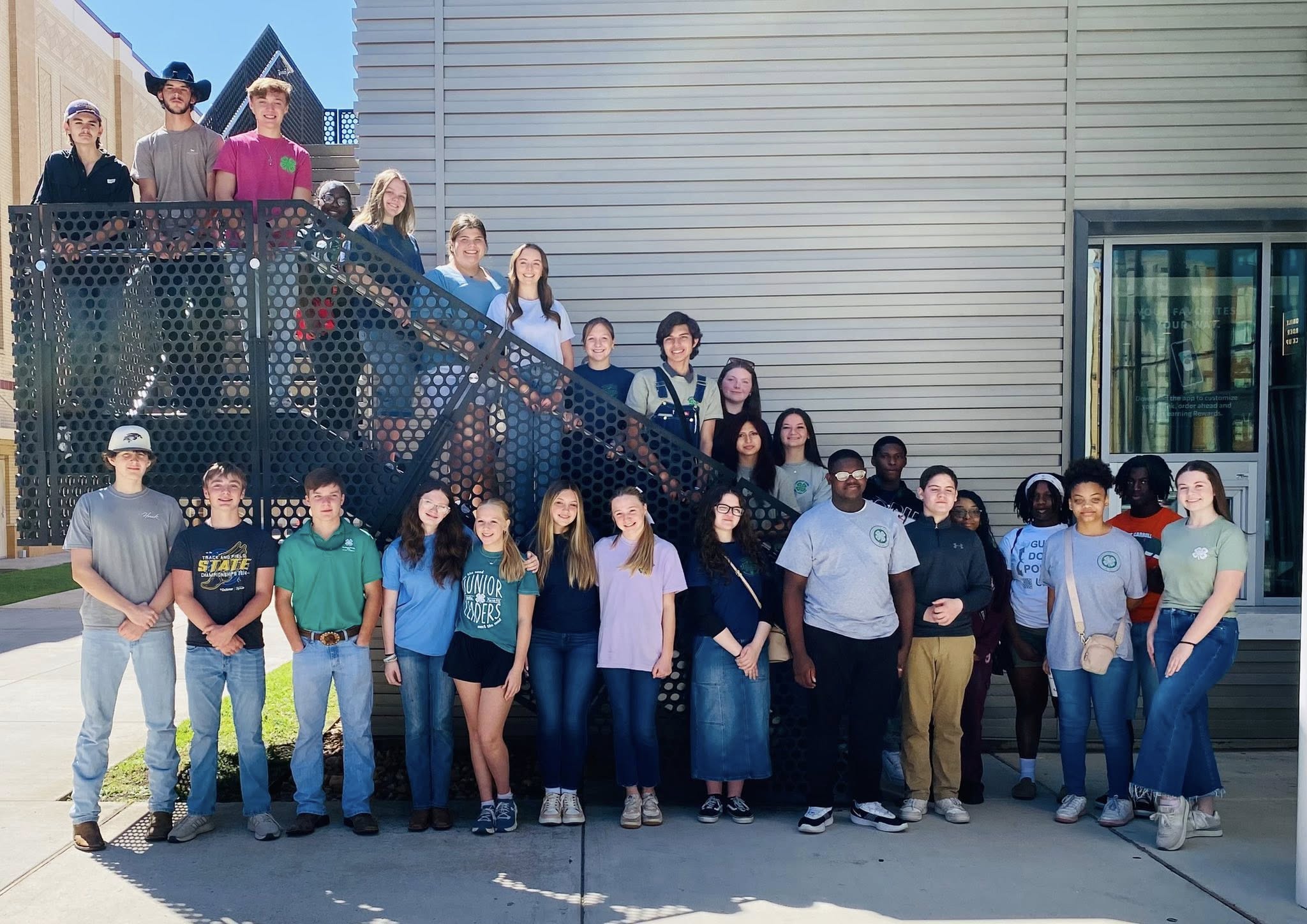 A group of teens posing for a photo.
